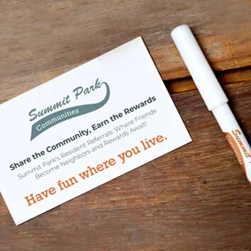 Referral card with Summit Park program information and a pen